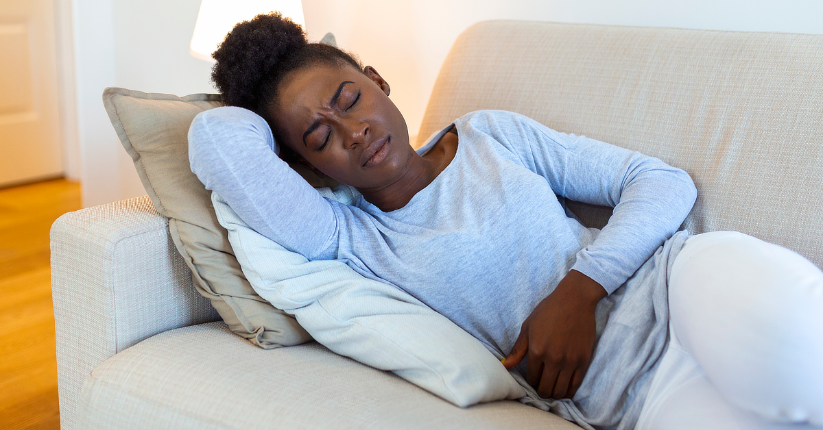 Woman suffering from bladder pain.