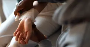 Person receiving treatment for burns.